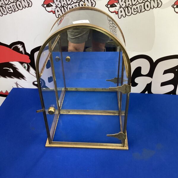 Small vintage glass display cabinet for collectibles.
