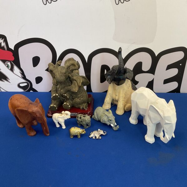Collection of ceramic and miniature elephant ornaments for home decor.