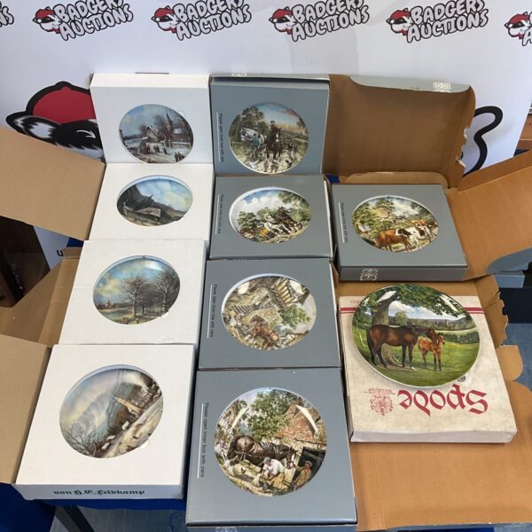 Vintage Spode collectors plates in a decorative collection.