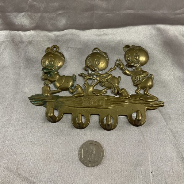 Vintage brass key hook featuring Huey, Dewey, and Louie.