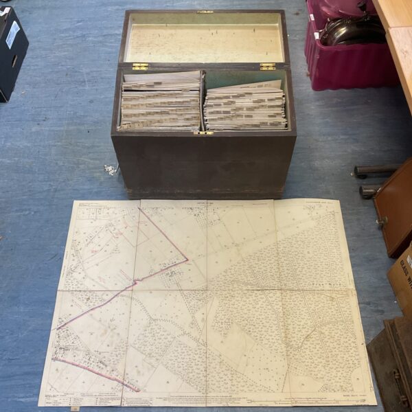 Antique wooden chest containing vintage Ordnance Survey maps from 1921.