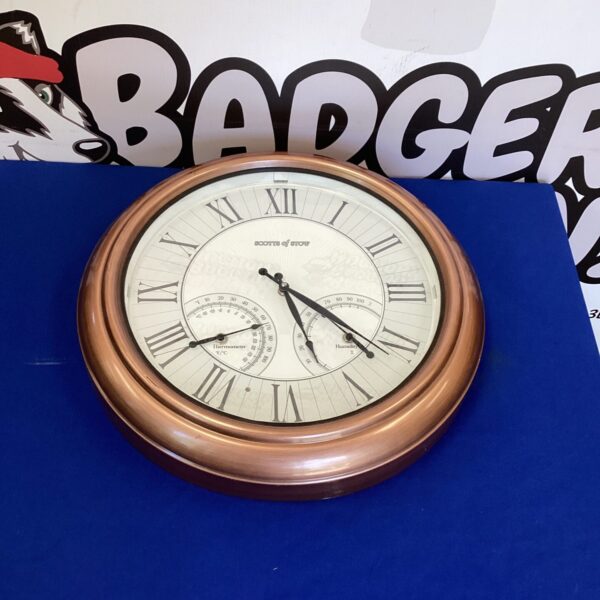 Vintage Stotts of Stow barometer clock with Roman numerals.