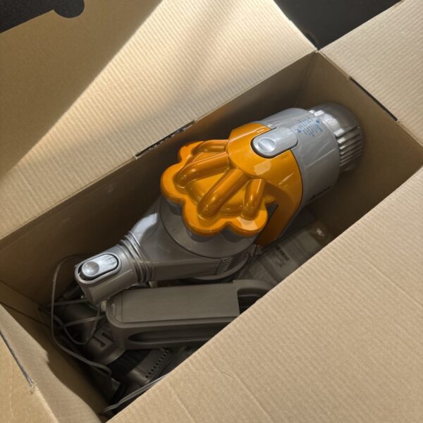 Used Dyson DC16 cordless vacuum cleaner with charger.