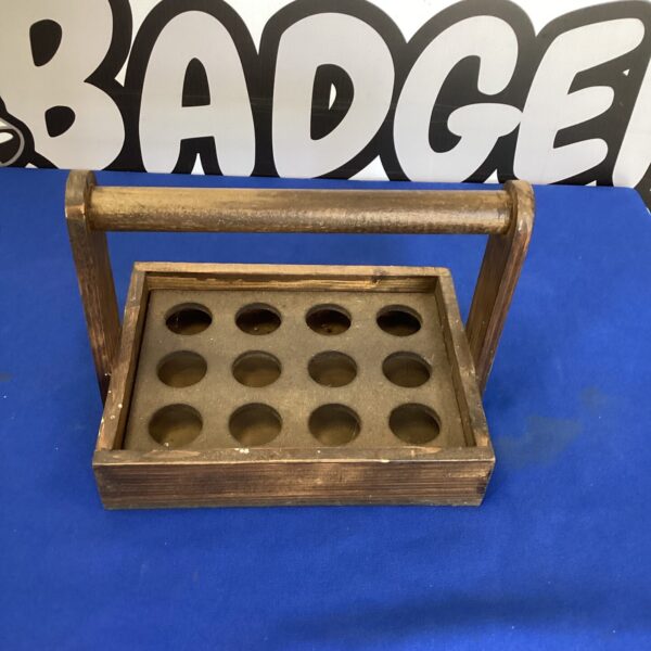 Vintage wooden egg carrier with compartments for a dozen eggs.