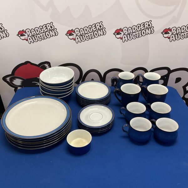 Blue Denby stoneware plates and mugs collection for kitchen use.
