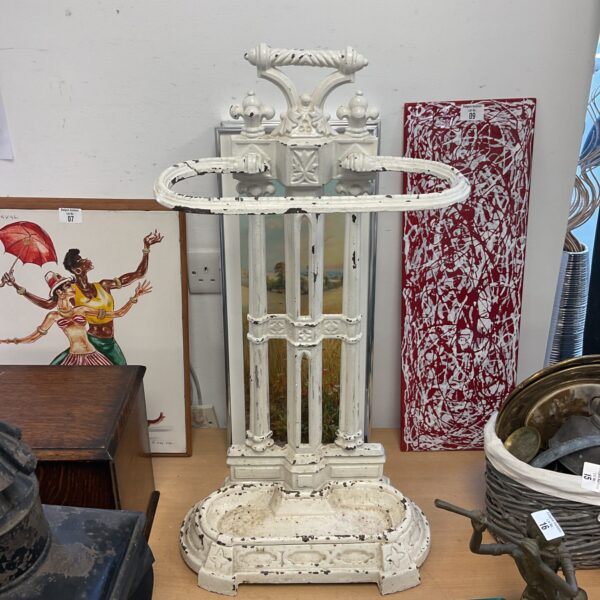 Antique Victorian cast iron stick stand with drip tray.