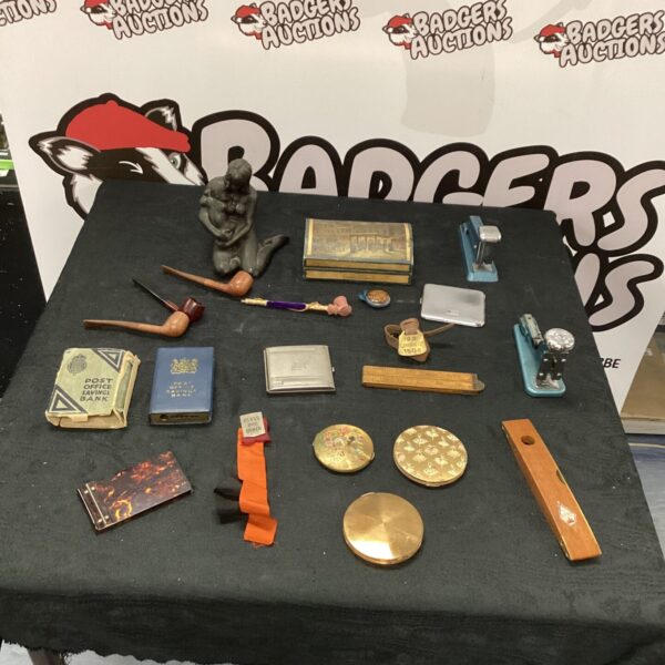 Vintage mixed lot of collectibles including smoking pipes and curios.