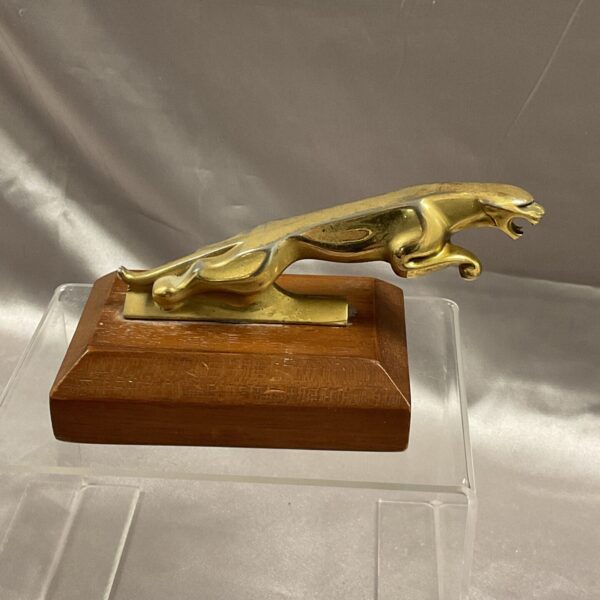 Vintage goldtone Jaguar bonnet mascot on mahogany base