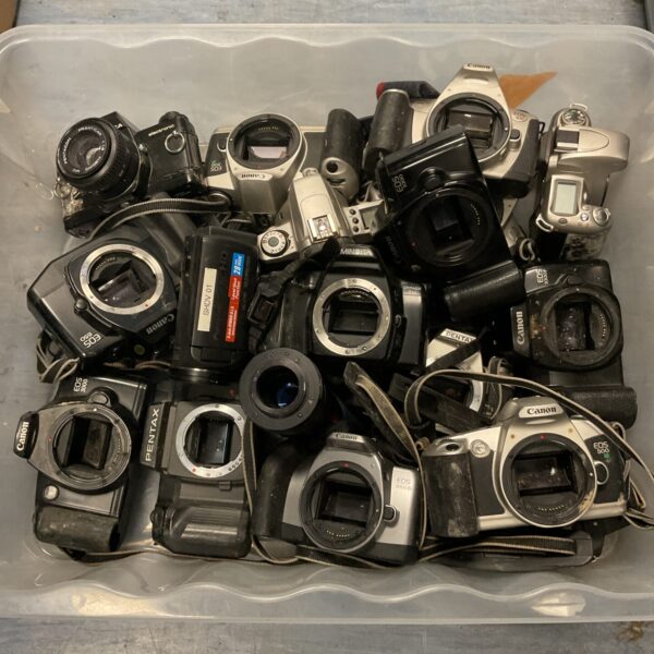 Vintage camera lot featuring Canon and Minolta film cameras.