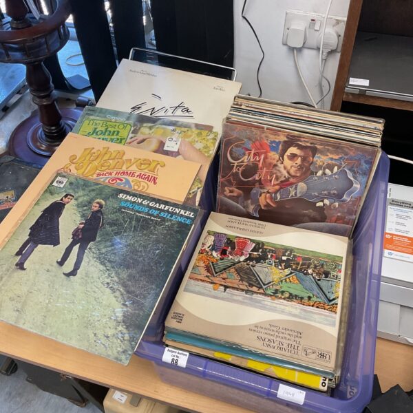 Vintage vinyl record collection featuring Simon & Garfunkel albums.