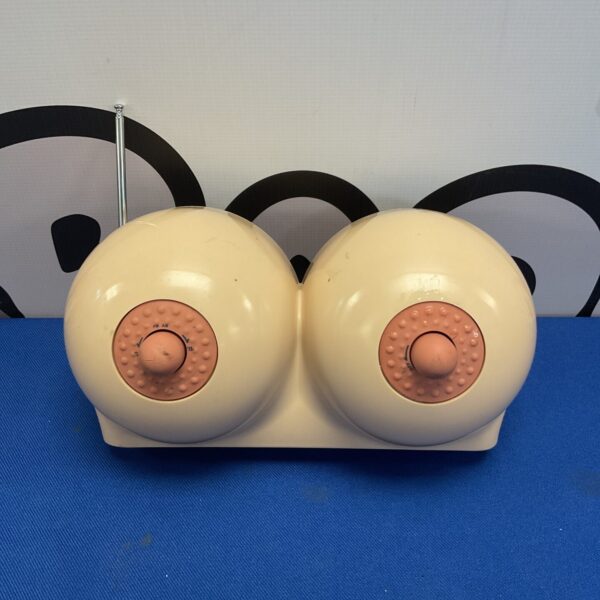 Vintage novelty radio shaped like breasts, a unique collectible.