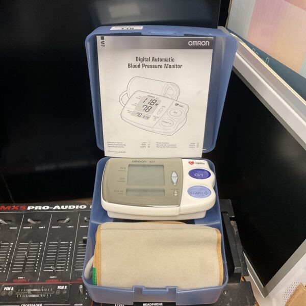 Omron M7 digital automatic blood pressure monitor in open case.