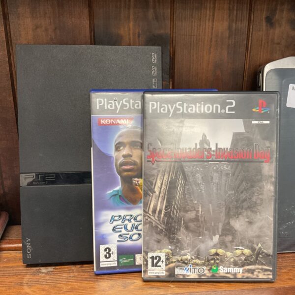 Sony PlayStation 2 slim console with games for retro gaming.