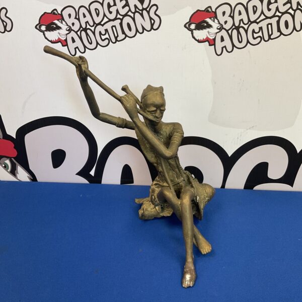 Vintage African brass sculpture of a tribal musician.