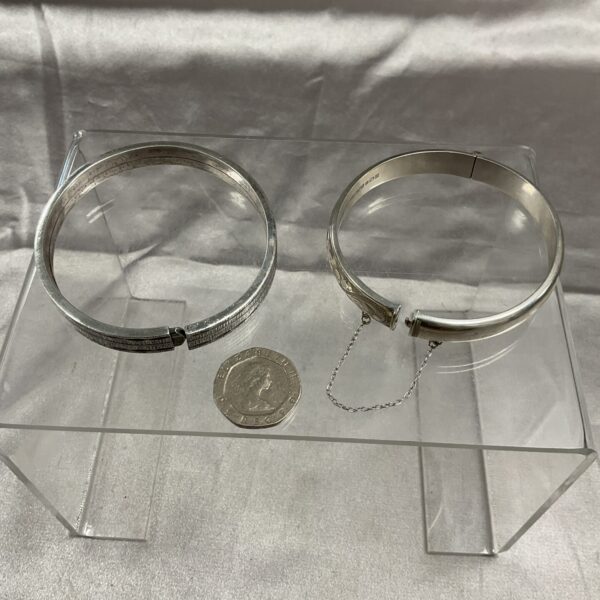 Pair of vintage silver bangles with a minimalist design.