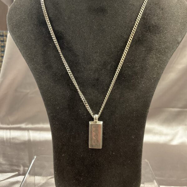 Heavy silver ingot chain necklace with pendant.