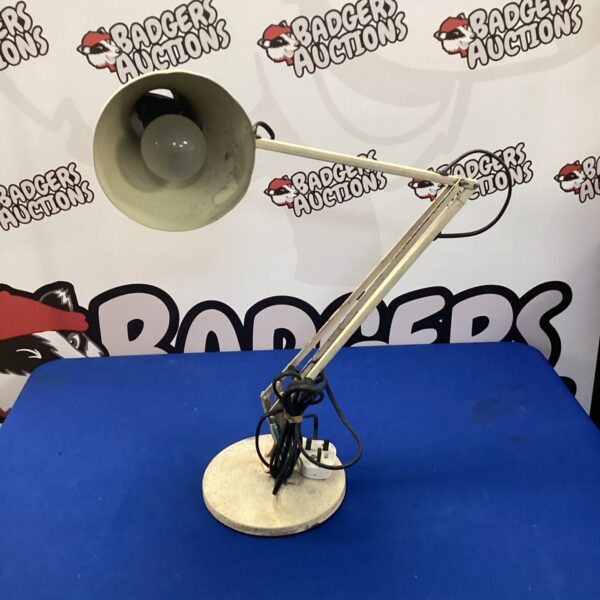 Vintage Anglepoise lamp with adjustable arm and weighted base.