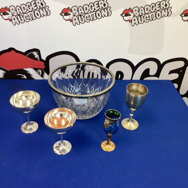 Vintage silverplate goblets and cut glass punch bowl set for entertaining.