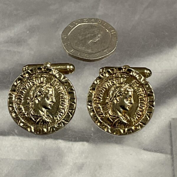 Hallmarked silver gilt cufflinks with classical detailing.
