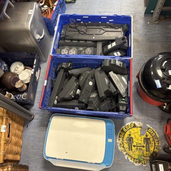 Blue crates filled with Electrak plug sockets and circuit breakers.