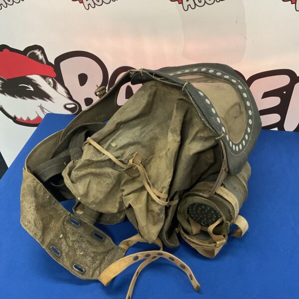 Vintage WW2 babies gas mask, front view, historical collectible.