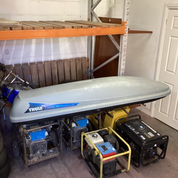 Used Thule Ocean 500 car roof box for secure travel storage.