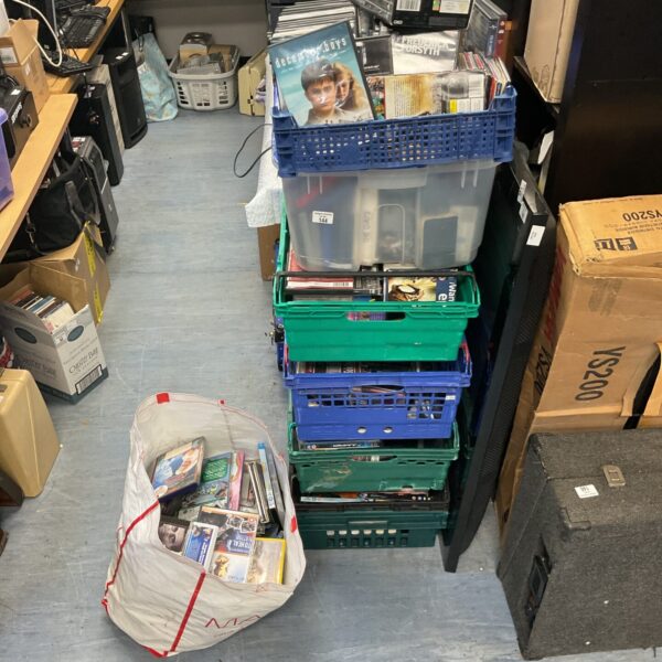 Large collection of assorted DVDs for home entertainment.
