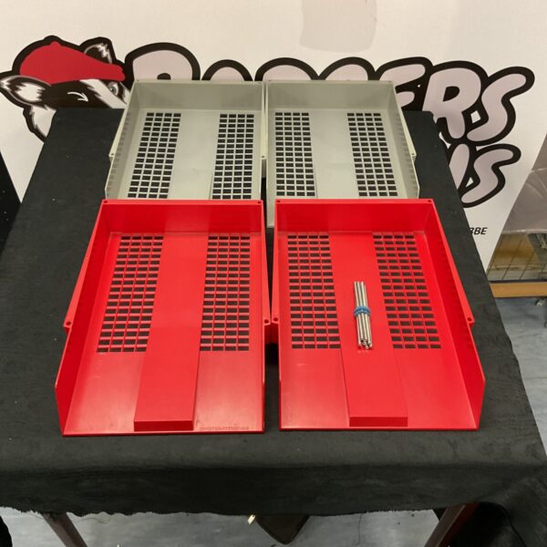 Lot of four plastic office organiser trays for desk tidying.