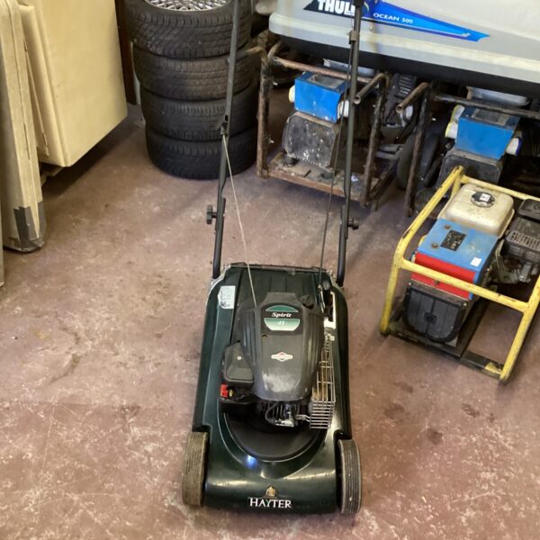 Hayter Spirit 41 petrol lawn mower in a garden setting.