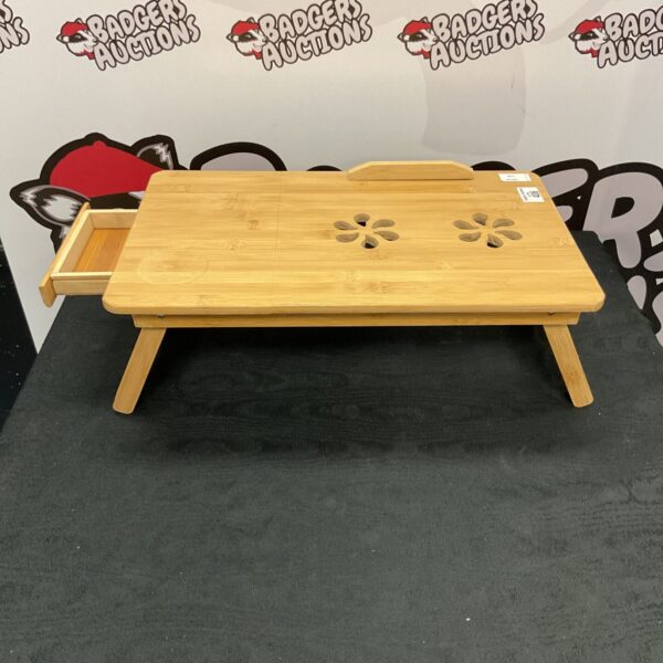 Portable bamboo laptop table for comfortable working or studying.