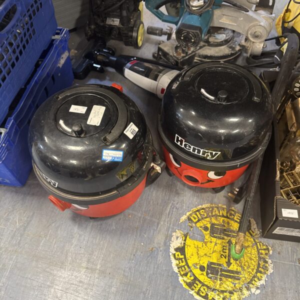 Two red and black Numatic Henry Hoover bodies for spares or repair.