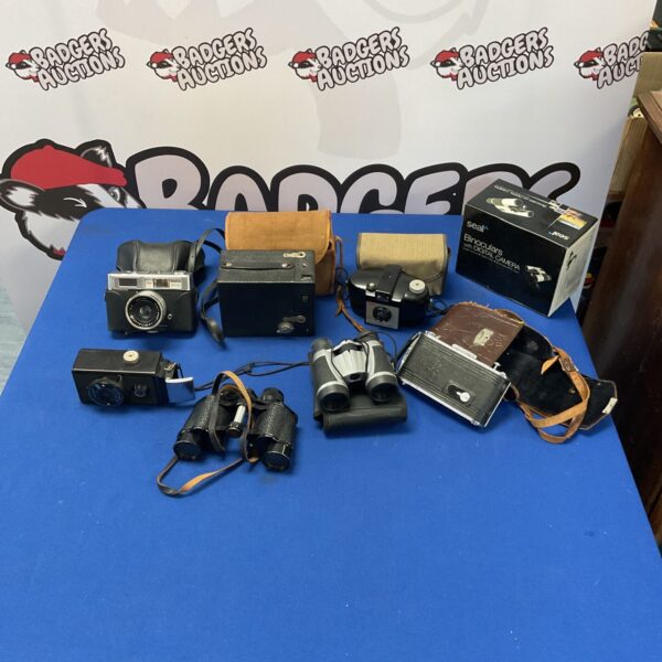 Vintage camera and binocular lot including Kodak and Seal brands.