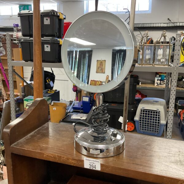 Vintage ring light mirror on a table.