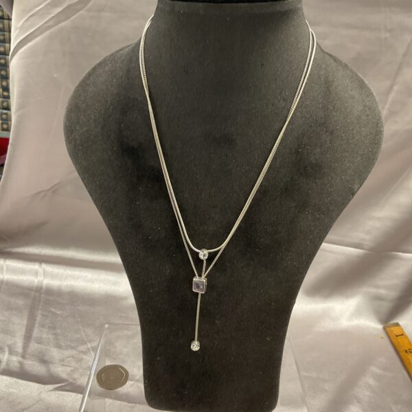 Silver amethyst necklace set with two stone pendant.