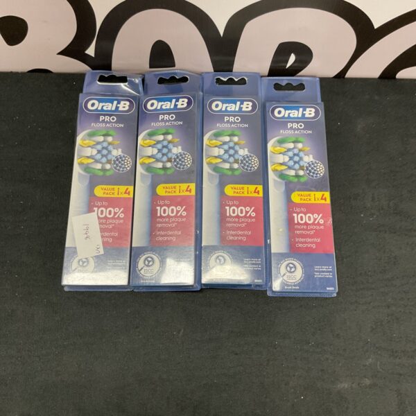 Four Oral B Pro Floss Action brush heads in original packaging.