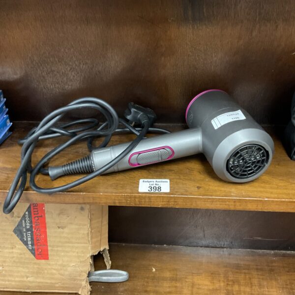 Close-up of a silver Dyson hair dryer for fast styling.