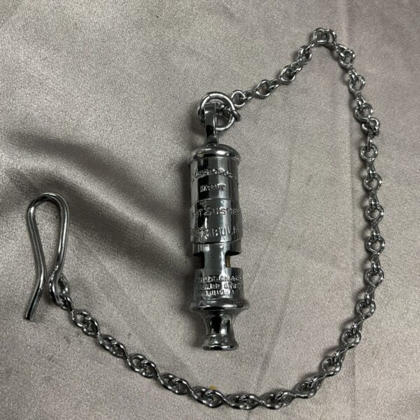 Antique East Sussex Constabulary police whistle with chain.