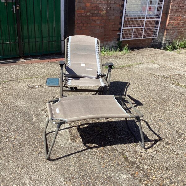 Quest Elite reclining garden chair with footrest in a garden setting.