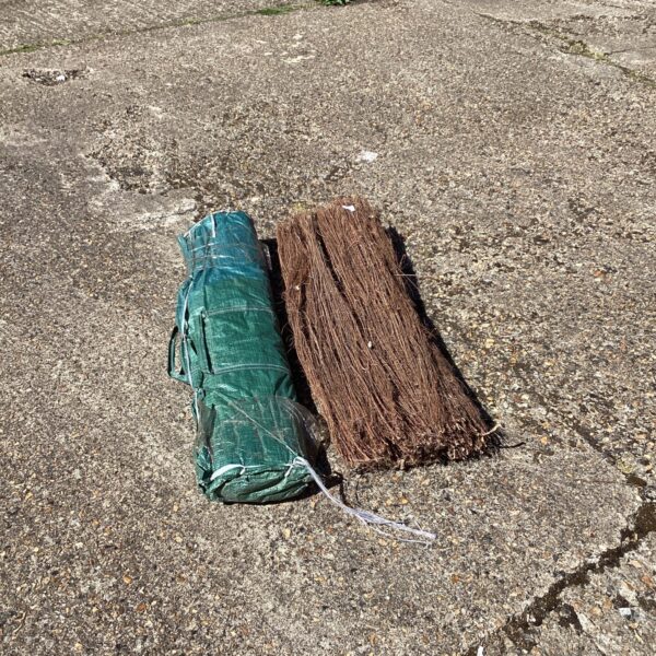 Two rolls of natural screening hedge for garden privacy.