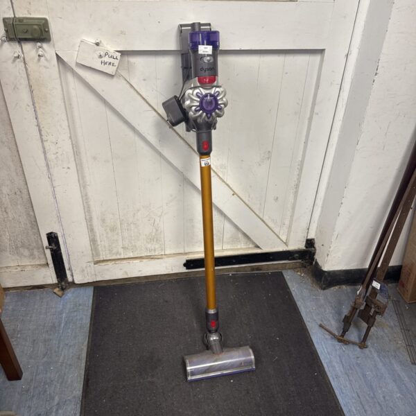 Front view of a Dyson V8 cordless stick vacuum cleaner.