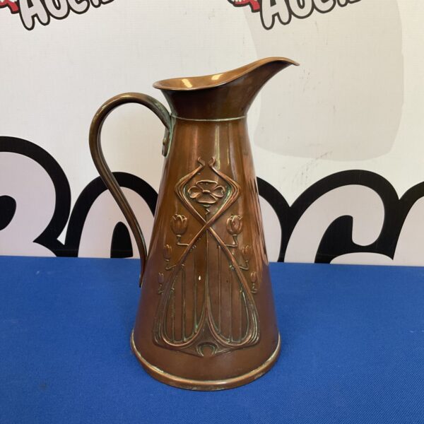 Antique Joseph Sankey copper pitcher with patina.