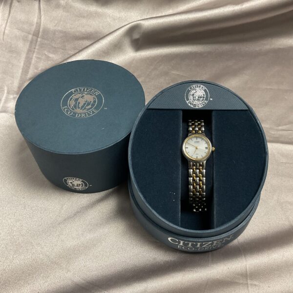 Gold tone Citizen Eco Drive ladies wristwatch in its original box.