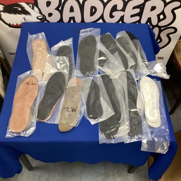 Mixed lot of gel insoles for shoe comfort and support.