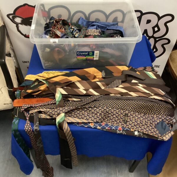 Lot of assorted vintage ties and tie racks for sale.