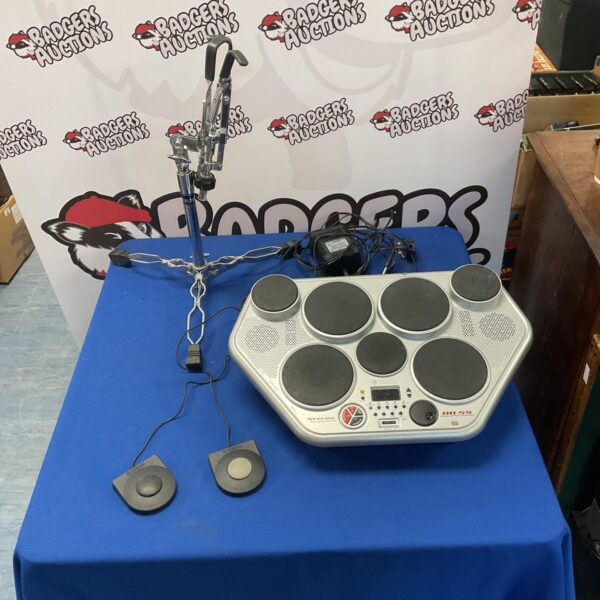Yamaha DD-55 drum machine with stand and pedals, vintage electronic kit.