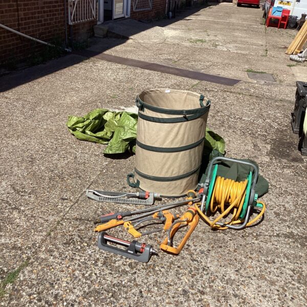 Garden watering kit with hosepipe, sprinklers and leaf bag.