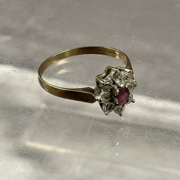 Antique 9 carat gold ring with ruby and diamond cluster.