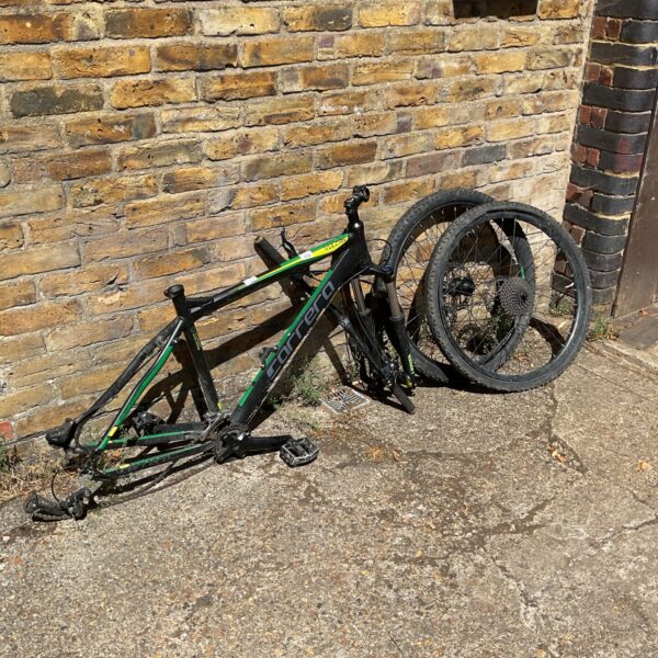 Used Carrera Vulcan bike frame with wheels and handlebar.