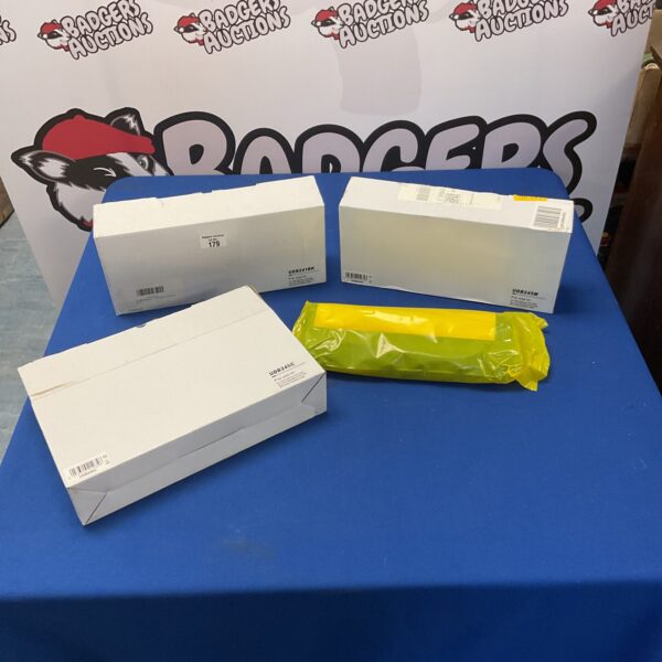 Lot of three new UDB245M toner cartridges in packaging.