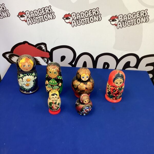Colorful floral Russian nesting dolls set on display.